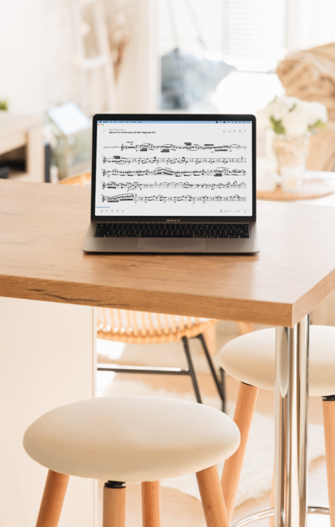 A digital score open on the Enote app, shown on a Macbook Pro sitting on a kitchen table.